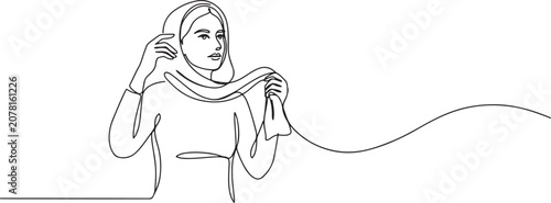 Valokuva A woman opposes the obligation to wear a headscarf