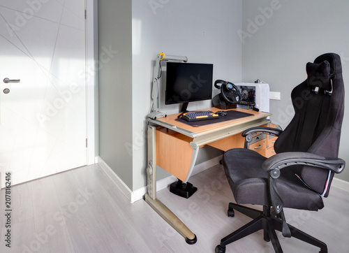 Modern home office workspace with ergonomic chair gaming setup and computer desk interior with copy space