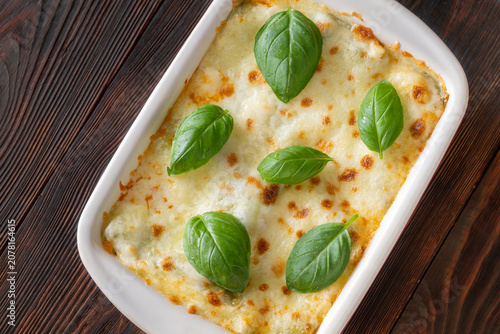 Rustic Lasagna Bolognese In Ceramic Baking Dish With Golden Cheese Topping