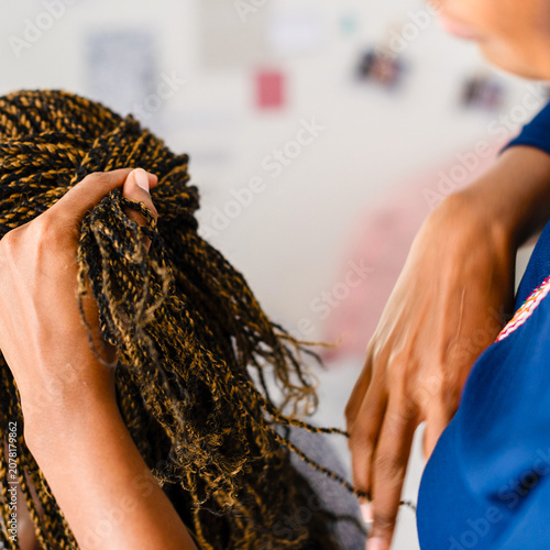 Принти на полотні Braiding hair with skilled hands