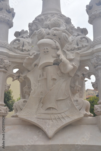 фотографія Heraldic Coat of Arms Carved in Stone on Historic Monument