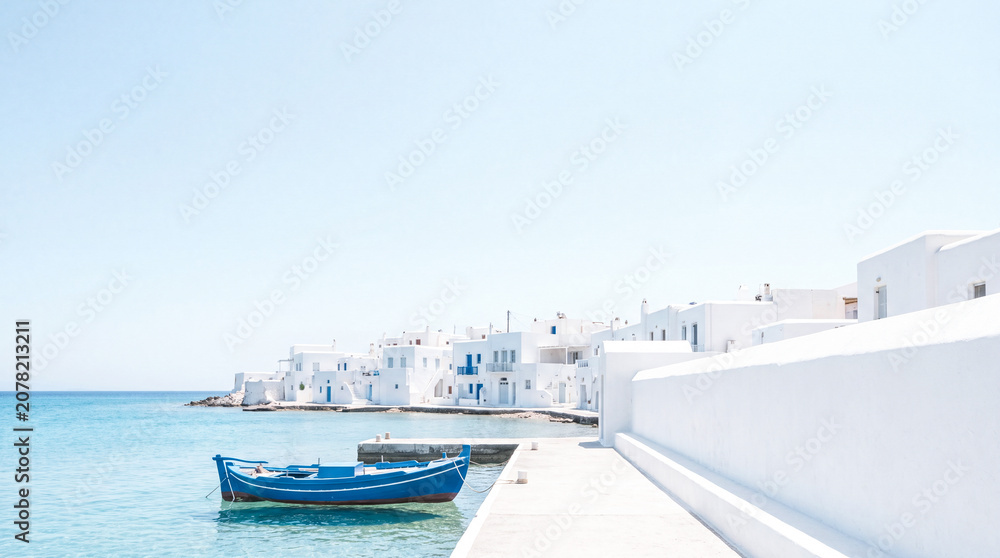 Fototapeta premium Serene Coastal Village, Whitewashed Houses by Calm Sea