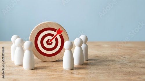 Business target audience concept with wooden figures and dartboard