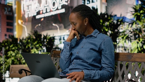 Cuadro en lienzo Upset digital nomad girl struggling to work on laptop in the park, barely meeting deadlines, worried remote worker doing freelancing outside, using notebook and feeling burnout, bad news