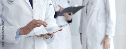 Fotografía Healthcare professional using a digital tablet for patient data management, doct