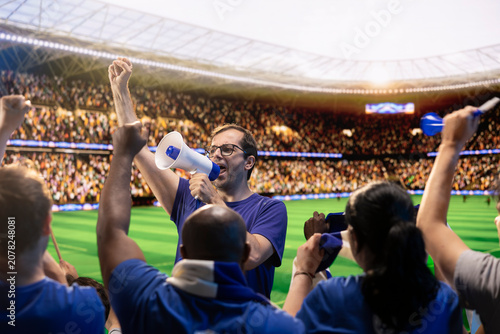Slika na platnu Football supporters chanting with megaphone in sports arena during match day, fan leader energizing crowd, rallying them to create loud stadium atmosphere, for sports fan culture and match day energy