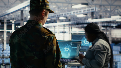 Konstfotografi Army commander uses AI tools in a server room to manage secure military computer systems