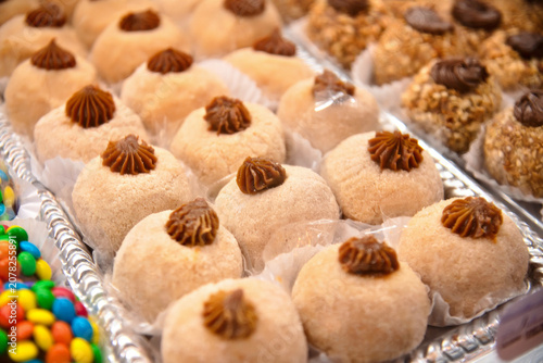 Brazilian churros brigadeiro gourmet sweets with dulce de leche on party tray.