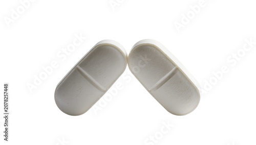 фотографія Isolated two oval white scored pharmaceutical pills for health, healing, and med