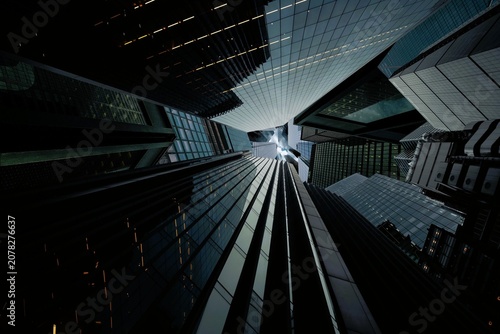 Canvas Print Dramatic low angle worm eye view looking up at modern glass skyscrapers convergi