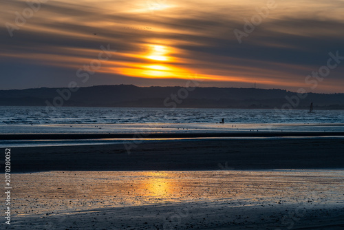 Sunset on Cambersand beach, East Sussex, England, in winter.