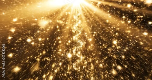 Golden particles and light rays falling in a luxury abstract background