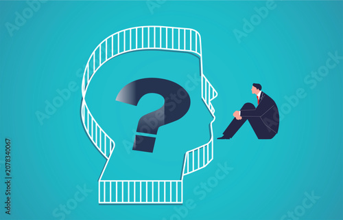 Searching for solutions, self-doubt and uncertainty, mental illness or mental health. A businessman curls up next to the fence, hugging his legs