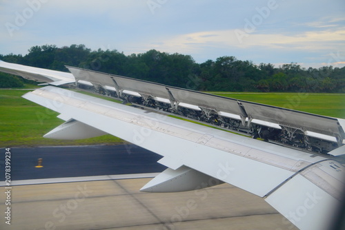 Canvas Print fully deployed spoilers (or speed brakes) on the top surface of a commercial air