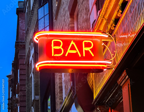 Photography Close-Up Red Neon Bar Sign Contrasted Against Deep Blue Sky
