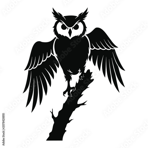 Majestic owl silhouette with spread wings on a branch