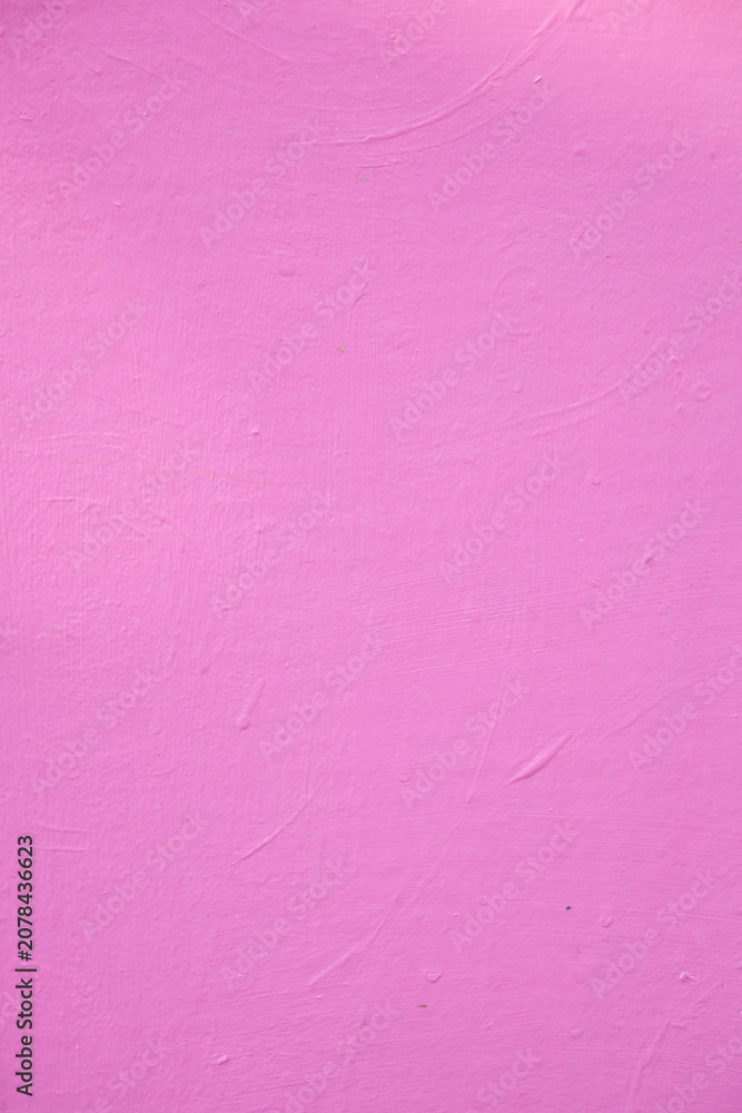 Fototapeta premium Bright pink wall with smooth texture in simple setting