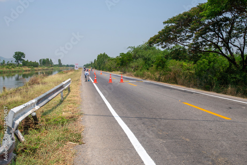 Workers are painting and improving the road.