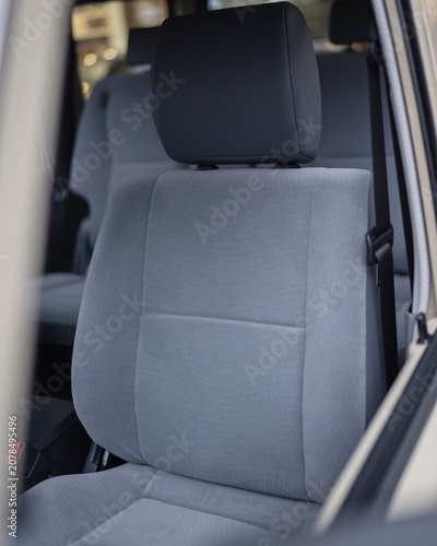 Gray Car Backseat Interior With Headrest And Seatbelt.