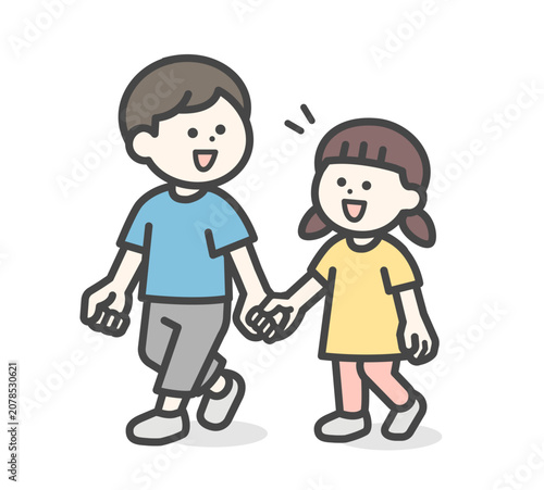 A boy and a girl walking hand in hand.