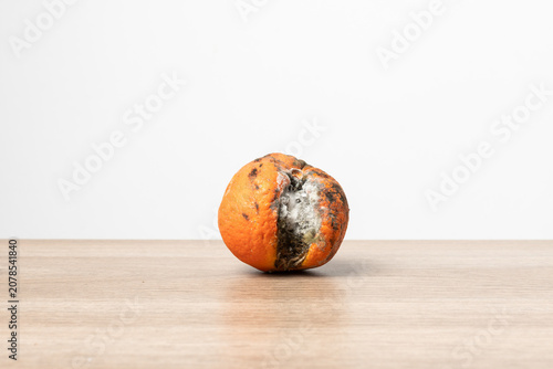 Canvastavla Rotten Orange on Wooden Table With Copy Space