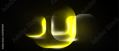 Fotografie Abstract yellow light streaks form letter shapes against dark background