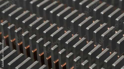 Close up of a metal heatsink with many fins for cooling electronics.