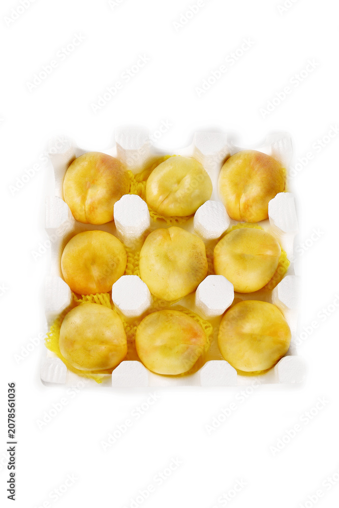 Fototapeta premium Fresh Yellow Peaches in Carton - Studio Food Photography