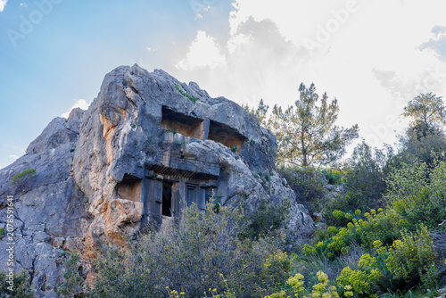 Cuadro en lienzo Ancient Lycian rock-cut tomb carved into a mountain cliffside