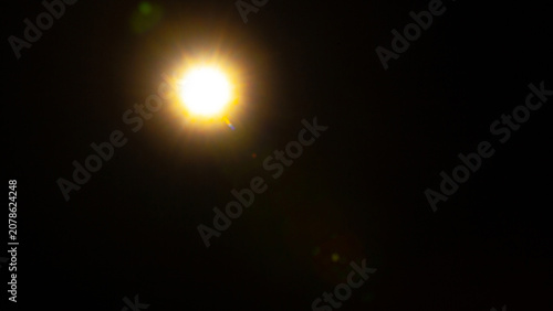Sun flare on the black background