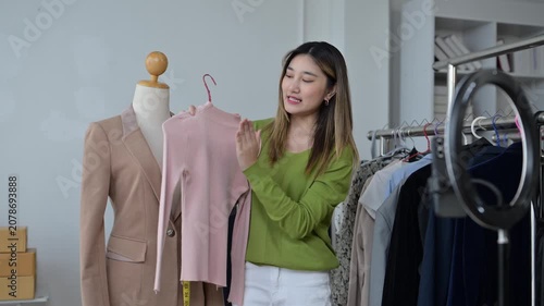Fashion designer presenting clothes online