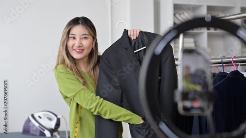 Fashion designer presenting clothes on live stream