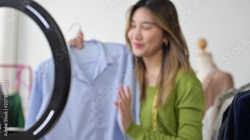 Fashion designer presenting clothes during live stream