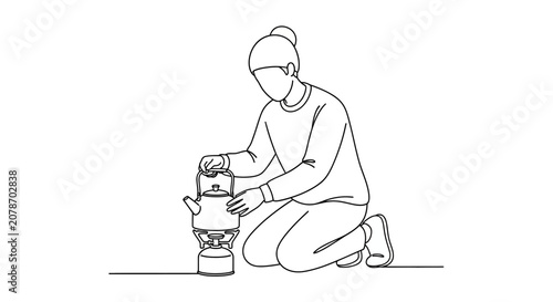 Person cooking outdoors with portable camp stove.