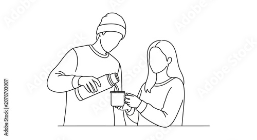 Two people sharing a drink together at a table.
