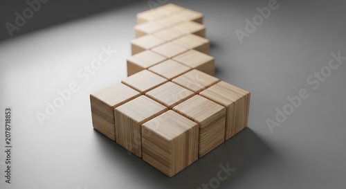 Wooden blocks arranged in an arrow shape on a gray surface