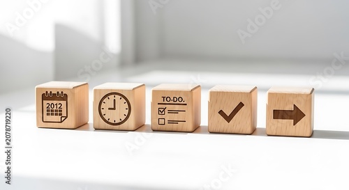 Wooden blocks with todo list and calendar icons on white surface