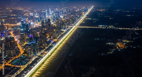 Nighttime Cityscape with Illuminated Skyline and Bright Streets.