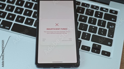 Close up of person using smartphone to pay online with transaction declined due to insufficient funds