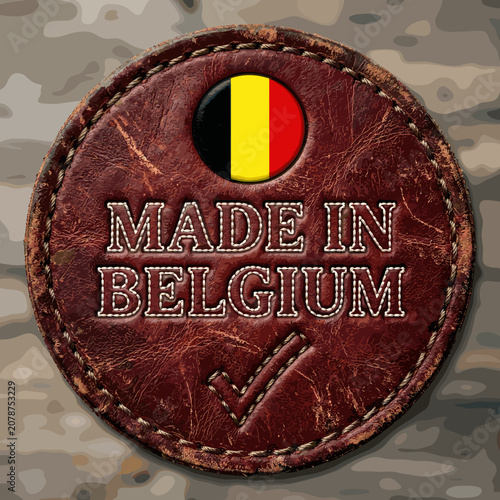 Leather Patch with Belgian Flag and Made in Belgium Text on Rustic Wooden Background