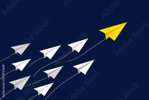 Yellow Paper Airplane Leading White Planes in Flight Against Dark Blue Sky