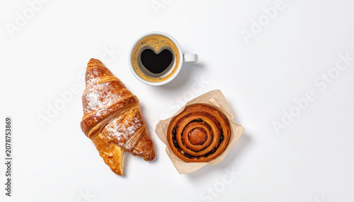 Top View: Croissant, Pain au Raisin, and Heart-Shaped Coffee on White Background