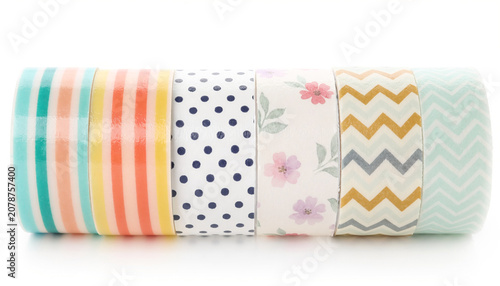 multiple colorful washi tapes with beautiful prints isolated on a white background
