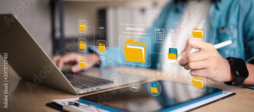 Bild auf Leinwand Business person organizing digital files with online document management system on tablet and laptop, data storage folders, smart office