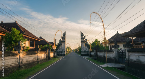 Traditional Balinese Village Street Featuring Iconic Split Gateway Candi Bentar at Sunrise 