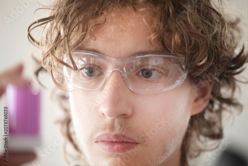 Obraz na plátně young scientist male working in a labor, portrait