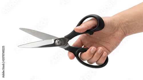 Hand holding black handled scissors studio shot isolated on transparent background for cut and craft projects