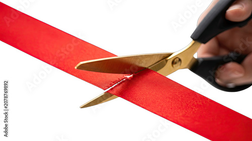 Hand cutting red ribbon with gold scissors isolated on transparent background