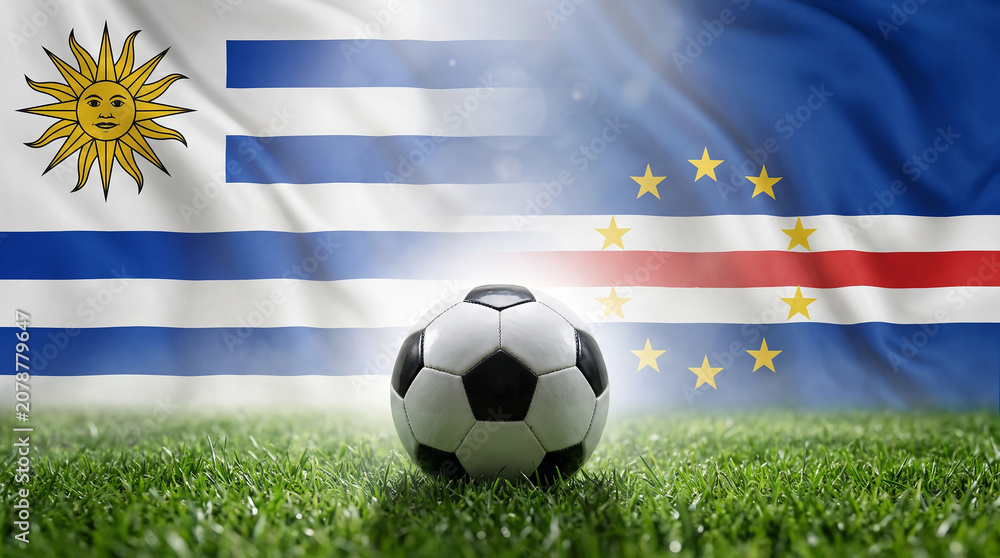 Naklejka premium Soccer Diplomacy: A soccer ball rests on a lush green field, superimposed with the flags of Uruguay and Cabo Verde, symbolizing the sport's power to unite nations and foster international relations