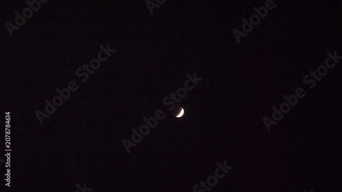 Blood crescent moon Lunar Eclipse on black background in the dark night sky